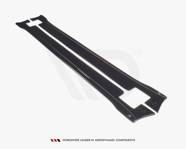 Two sleek, black aerodynamic side skirts lay side by side on a plain white surface. Text at the bottom reads, "WORLDWIDE LEADER IN AERODYNAMIC COMPONENTS."