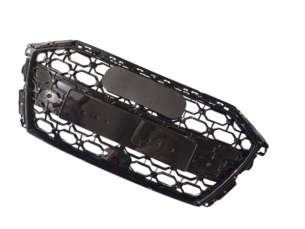 A hexagonal-patterned black car grille, featuring a solid central plate, is displayed on a white background, highlighting its structure and design elements.