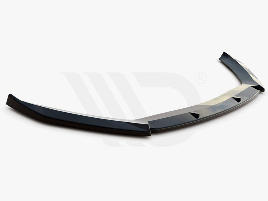 A black aerodynamic car spoiler lies on a white background. Text below reads: "WORLDWIDE LEADER IN AERODYNAMIC COMPONENTS."