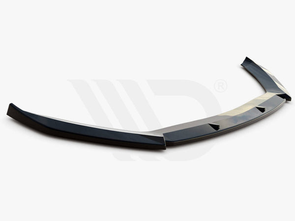 A black aerodynamic car spoiler lies on a white background. Text below reads: "WORLDWIDE LEADER IN AERODYNAMIC COMPONENTS."