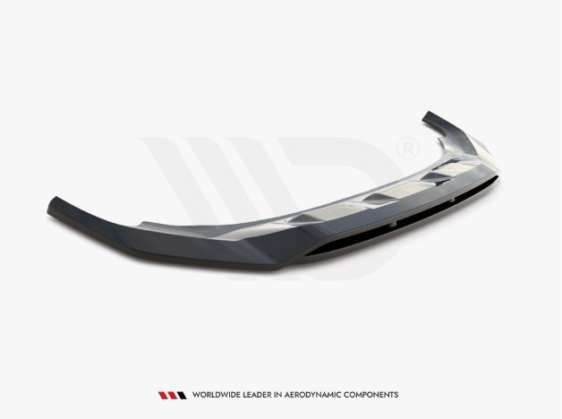 A sleek car bumper sits isolated against a white background, featuring aggressive lines. Text below reads, "WORLDWIDE LEADER IN AERODYNAMIC COMPONENTS."