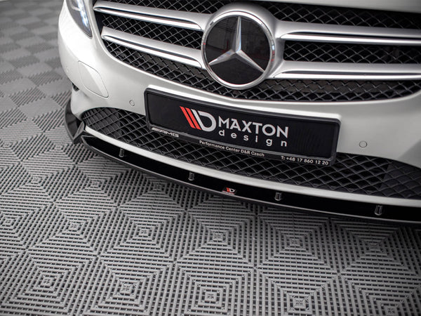 A car grille with a prominent emblem and "MAXTON design" plate is displayed. The vehicle is parked on a patterned, textured floor. Additional text: "Performance Center D&R Czach T: +48 17 860 12 20."