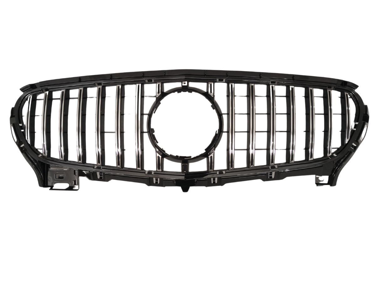 Chrome vehicle grille with vertical slats and a central circular emblem space, resting on a plain white background, displaying a sleek and modern design.