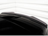 A sleek, shiny black car roof with a subtle aerodynamic spoiler is shown. The background consists of white horizontal paneling, creating a minimalistic and modern setting.
