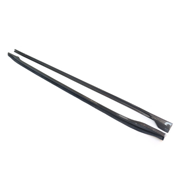 Two long, black carbon fiber strips lie parallel on a white surface, showcasing a sleek, textured appearance suitable for automotive or structural applications.