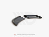 Two sleek, aerodynamic black plastic components rest on a white surface, angled adjacent to each other. Text below reads: 