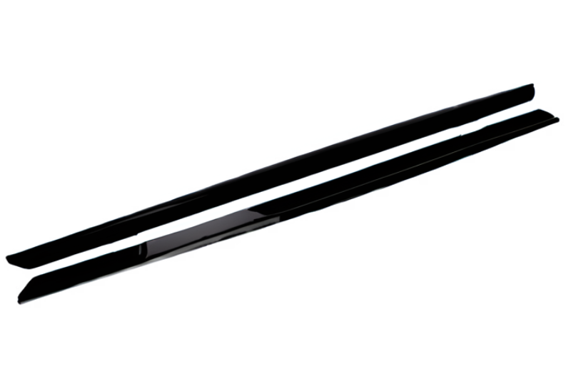 Two long, thin, black objects appear parallel and feature smooth surfaces, likely car side skirts, isolated on a white background with no text present.