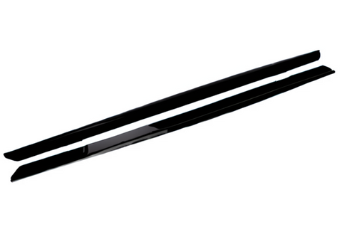 Two long, thin, black objects appear parallel and feature smooth surfaces, likely car side skirts, isolated on a white background with no text present.
