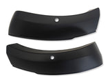 Two black curved bumper components with central round holes, positioned side by side against a plain white background.