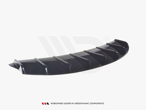 A black aerodynamic car diffuser, featuring multiple vertical fins, rests on a plain white background. Text: "WORLDWIDE LEADER IN AERODYNAMIC COMPONENTS" appears below the object.