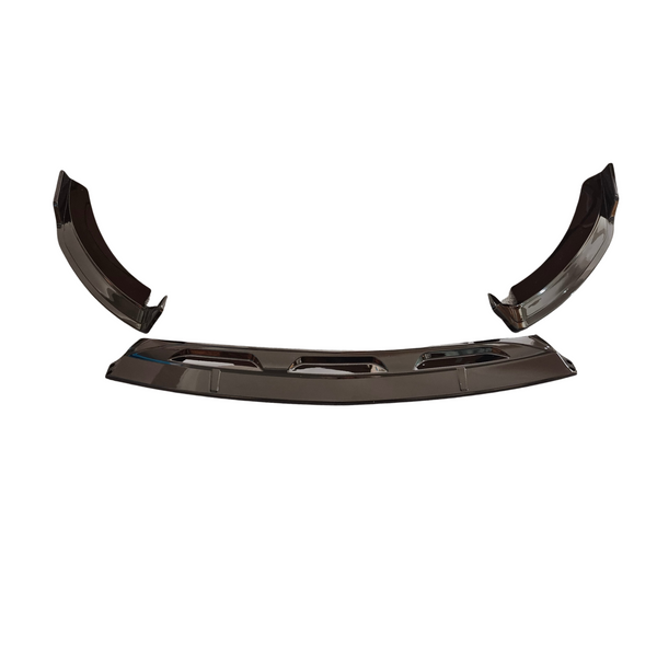 Curved metallic car parts, likely bumper elements, resting on a plain white background, showcasing reflective surfaces and angular edges.