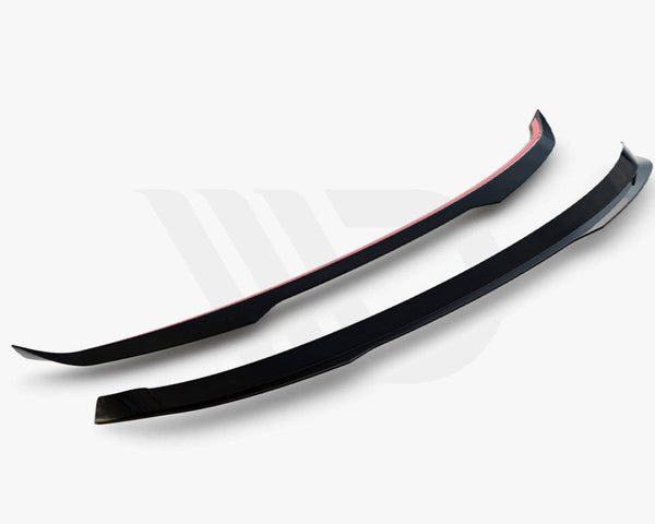 Two black aerodynamic components, slightly curved with red accents, are positioned parallel against a light background. Below, text reads, "WORLDWIDE LEADER IN AERODYNAMIC COMPONENTS."