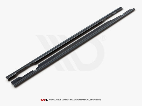 Two long, dark aerodynamic components lay parallel on a white surface. Text below reads, "WORLDWIDE LEADER IN AERODYNAMIC COMPONENTS."