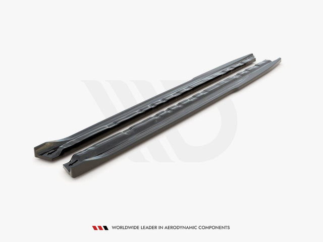 Two long, sleek car components are placed parallel on a plain surface. The text reads, "WORLDWIDE LEADER IN AERODYNAMIC COMPONENTS."