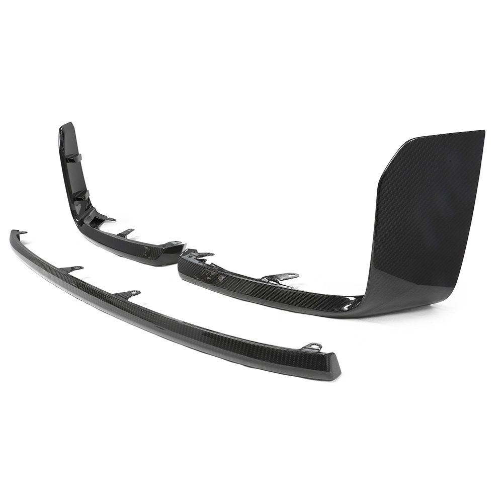 Two black carbon fiber car parts, likely aerodynamic components, are positioned on a white background. The parts feature a sleek, glossy finish with mounting features underneath.