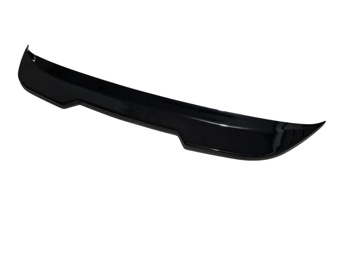 A sleek, black car spoiler displayed in isolation on a white background, showcasing its aerodynamic design with curved edges.