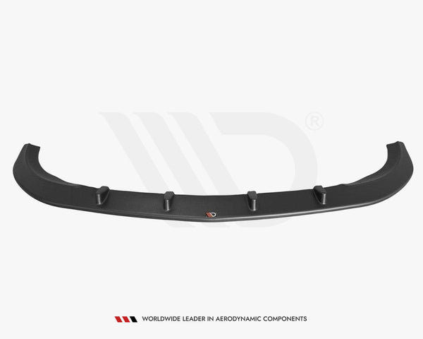 A black car lip spoiler with vertical fins lies isolated on a plain background. Text below reads: "WORLDWIDE LEADER IN AERODYNAMIC COMPONENTS."