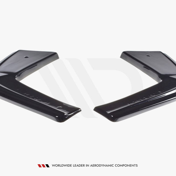 Two black aerodynamic components are positioned to face each other on a white background. Text below reads: "WORLDWIDE LEADER IN AERODYNAMIC COMPONENTS".