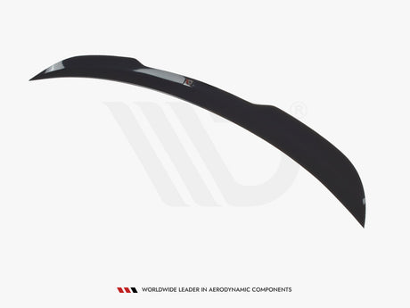 A sleek, black car spoiler curves elegantly against a white background, highlighting its aerodynamic design. Below, text reads "WORLDWIDE LEADER IN AERODYNAMIC COMPONENTS."