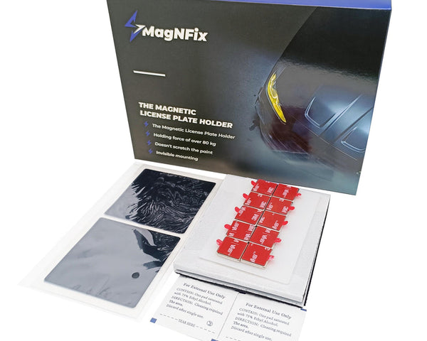 Box containing MagNFix magnetic license plate holder components. Includes magnets, adhesive mounts, and instructions. Text: "The Magnetic License Plate Holder," "Holding force of over 80 kg," "Doesn't scratch the paint," "Invisible mounting."