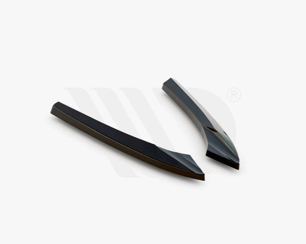 Two sleek, black aerodynamic components resting on a white background. They are angled and streamlined in design. Text at the bottom reads: "WORLDWIDE LEADER IN AERODYNAMIC COMPONENTS."