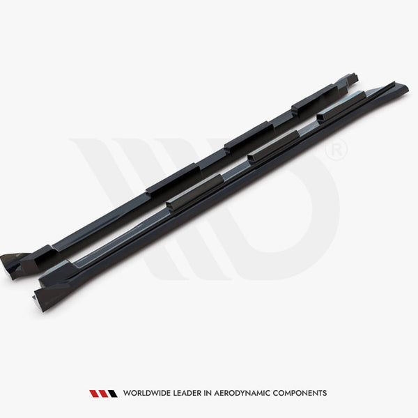 Two black aerodynamic components lie parallel on a white surface, featuring angular shapes. Text below reads: "WORLDWIDE LEADER IN AERODYNAMIC COMPONENTS."