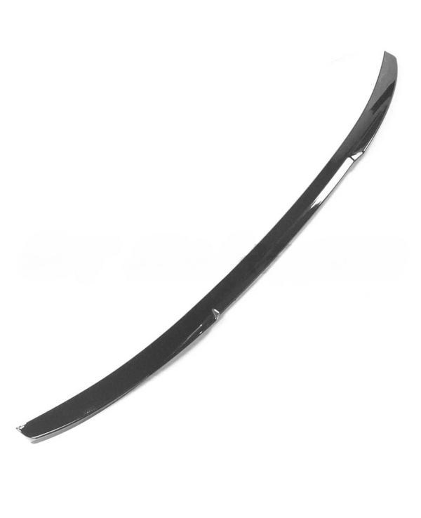 A long, curved, black car trim piece, likely a spoiler or edge guard, rests against a plain white background.