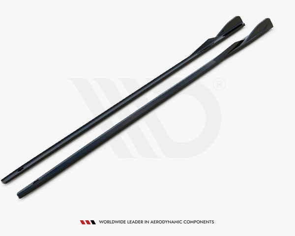 Two elongated, sleek black components lie parallel on a white surface. They have a contoured design for aerodynamics. Text below reads, "WORLDWIDE LEADER IN AERODYNAMIC COMPONENTS."