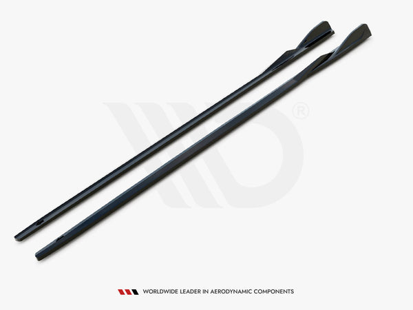 Two elongated, sleek black components lie parallel on a white surface. They have a contoured design for aerodynamics. Text below reads, "WORLDWIDE LEADER IN AERODYNAMIC COMPONENTS."