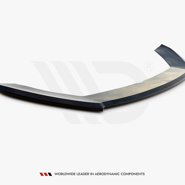 A sleek, black aerodynamic car spoiler rests on a plain white surface. Text below reads: "WORLDWIDE LEADER IN AERODYNAMIC COMPONENTS."
