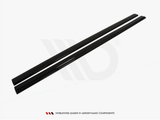 Two long, sleek black bars lie parallel, likely aerodynamic components, set against a plain, white background. Text below reads: 