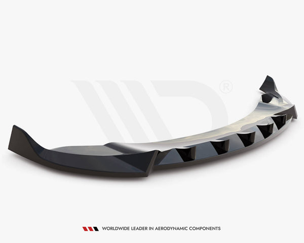 A black, aerodynamically designed car spoiler with angular edges rests against a plain white background. Text at the bottom reads, "WORLDWIDE LEADER IN AERODYNAMIC COMPONENTS."