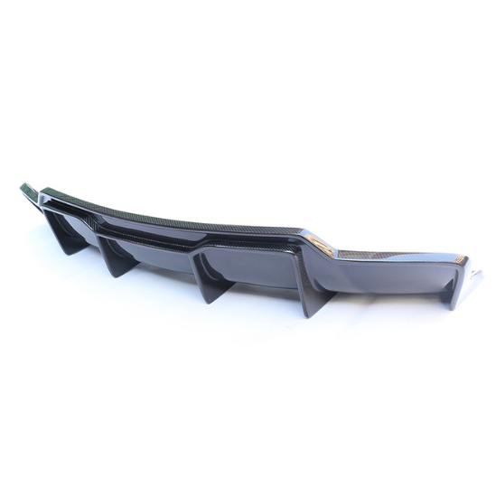 A sleek black car bumper diffuser with vertical fins is positioned on a plain white background, designed to enhance aerodynamics and style.