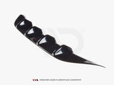Black aerodynamic component with four curved fins, resting on a white surface. Text reads: 