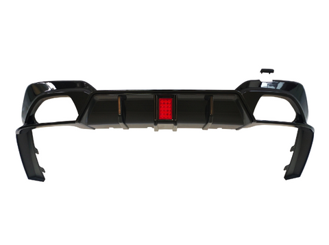 A black car bumper with a central red reflector is shown against a plain white background, highlighting its design and structure.