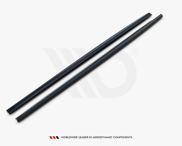 Two sleek, black aerodynamic components lie parallel on a white surface. Text below reads: "WORLDWIDE LEADER IN AERODYNAMIC COMPONENTS."