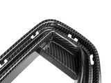 Curved carbon fiber frame with multiple slots and openings, designed for mounting or attaching, placed against a plain white background.