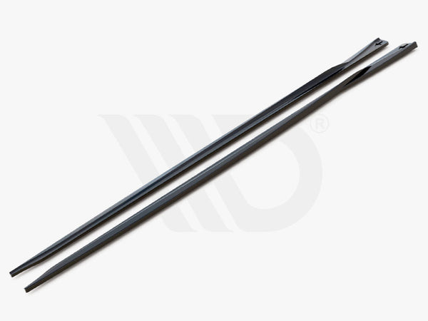 Two sleek, elongated black strips with tapered ends rest side-by-side on a plain gray surface. Text reads, "WORLDWIDE LEADER IN AERODYNAMIC COMPONENTS."