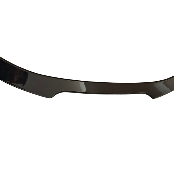 A black, glossy car spoiler is displayed, slightly curved upward at both ends, against a plain white background.