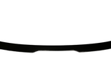 A black car spoiler lies flat against a white background, emphasizing its sleek, curved design and aerodynamic form.