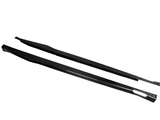 Two elongated carbon fiber side skirts, featuring a sleek design, rest parallel on a plain white background.