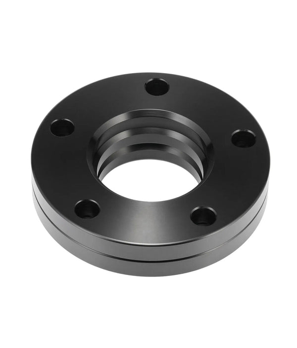 A black, circular metal flange has a central threaded hole and five evenly spaced bolt holes. It rests on a neutral, white background.