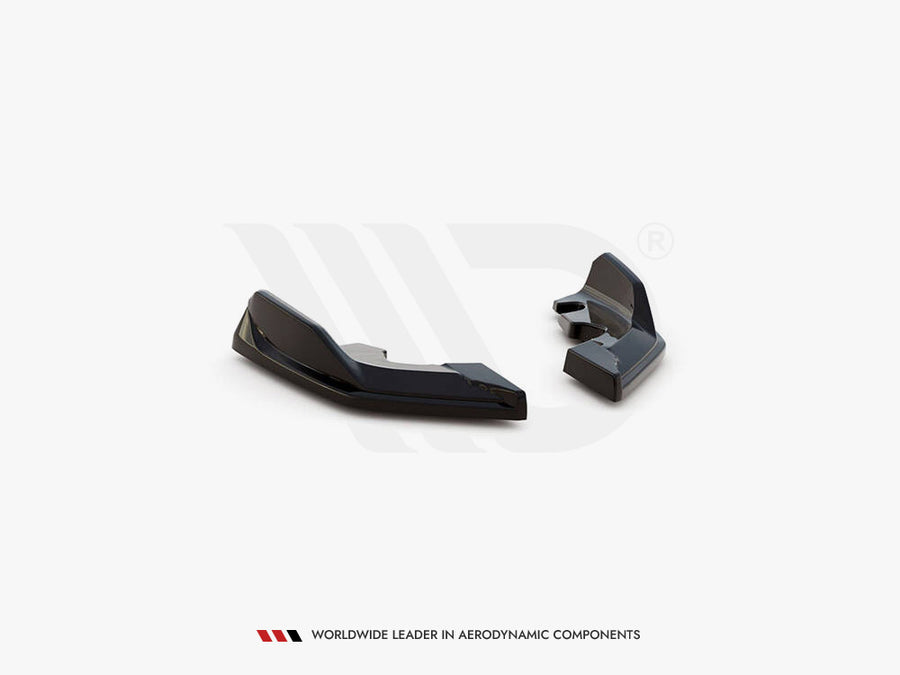 Two black aerodynamic components are displayed on a plain white background. There is text below: "WORLDWIDE LEADER IN AERODYNAMIC COMPONENTS."