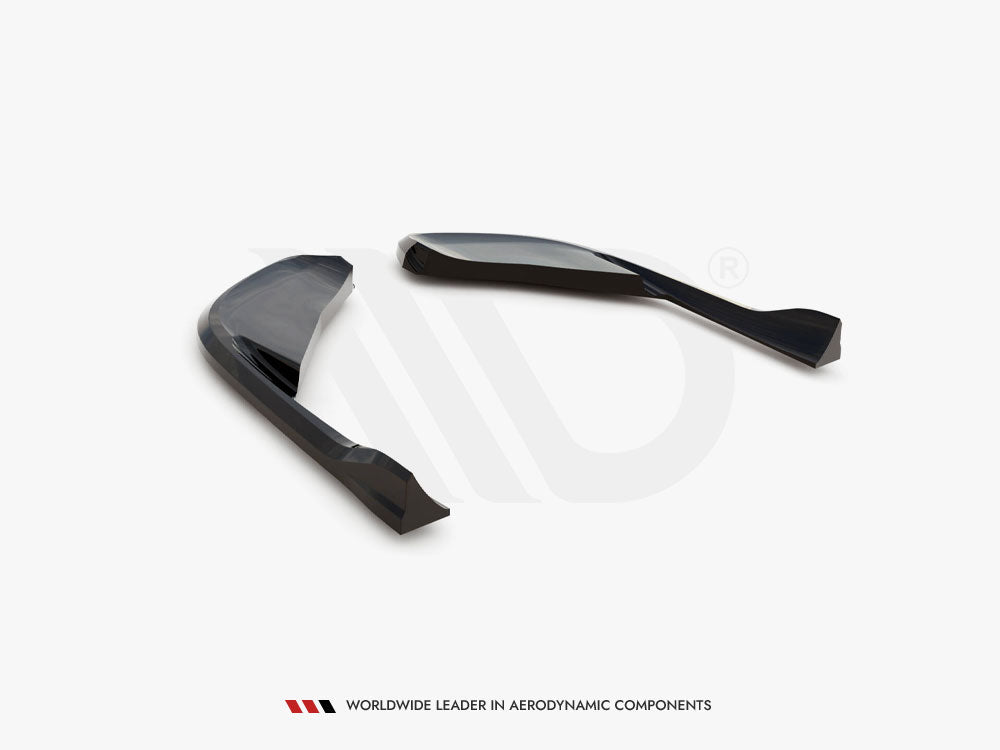 Two sleek, curved black aerodynamic components are positioned on a white surface. Below, text reads: "WORLDWIDE LEADER IN AERODYNAMIC COMPONENTS."