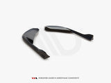 Two sleek, curved black aerodynamic components are positioned on a white surface. Below, text reads: "WORLDWIDE LEADER IN AERODYNAMIC COMPONENTS."
