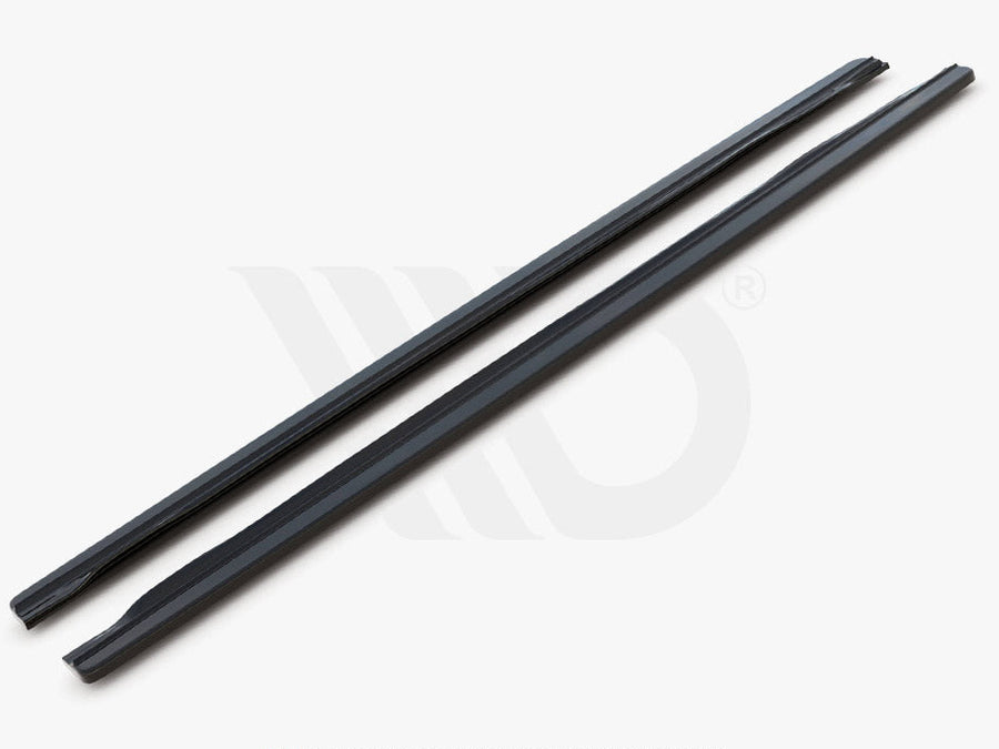 Two sleek, black aerodynamic components lie parallel on a light background. Text below reads: "WORLDWIDE LEADER IN AERODYNAMIC COMPONENTS."