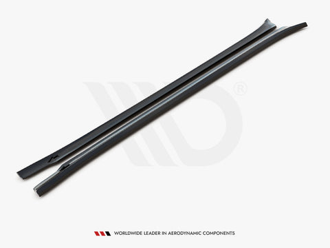 Two elongated, black aerodynamic bars lay side by side on a white surface. Text reads: "WORLDWIDE LEADER IN AERODYNAMIC COMPONENTS" at the bottom.