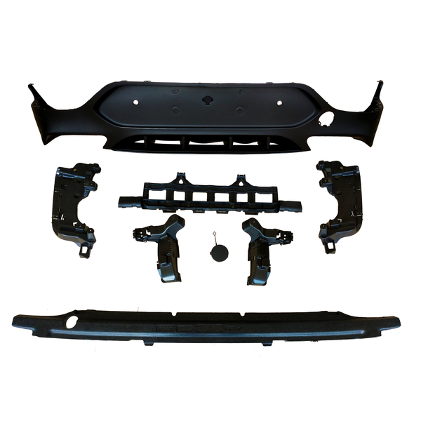 Various black plastic car bumper components are arranged on a white background, including a large panel, brackets, and a cover. The parts appear organized, showcasing individual pieces.