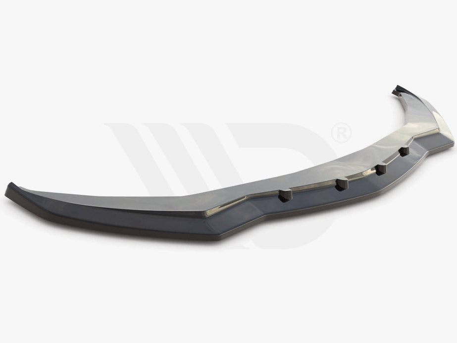 A black car front splitter with angular design and six protruding tabs sits on a plain white background. Text reads: "WORLDWIDE LEADER IN AERODYNAMIC COMPONENTS."