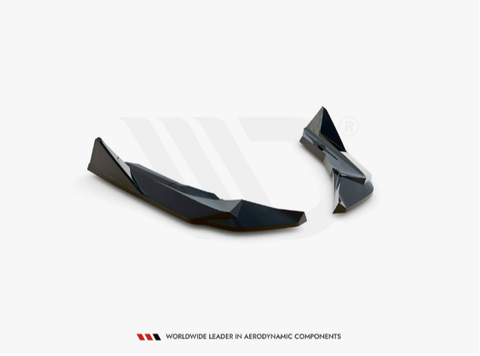 Two sleek, black aerodynamic components lie on a plain white surface. Text below reads: "Worldwide Leader in Aerodynamic Components."
